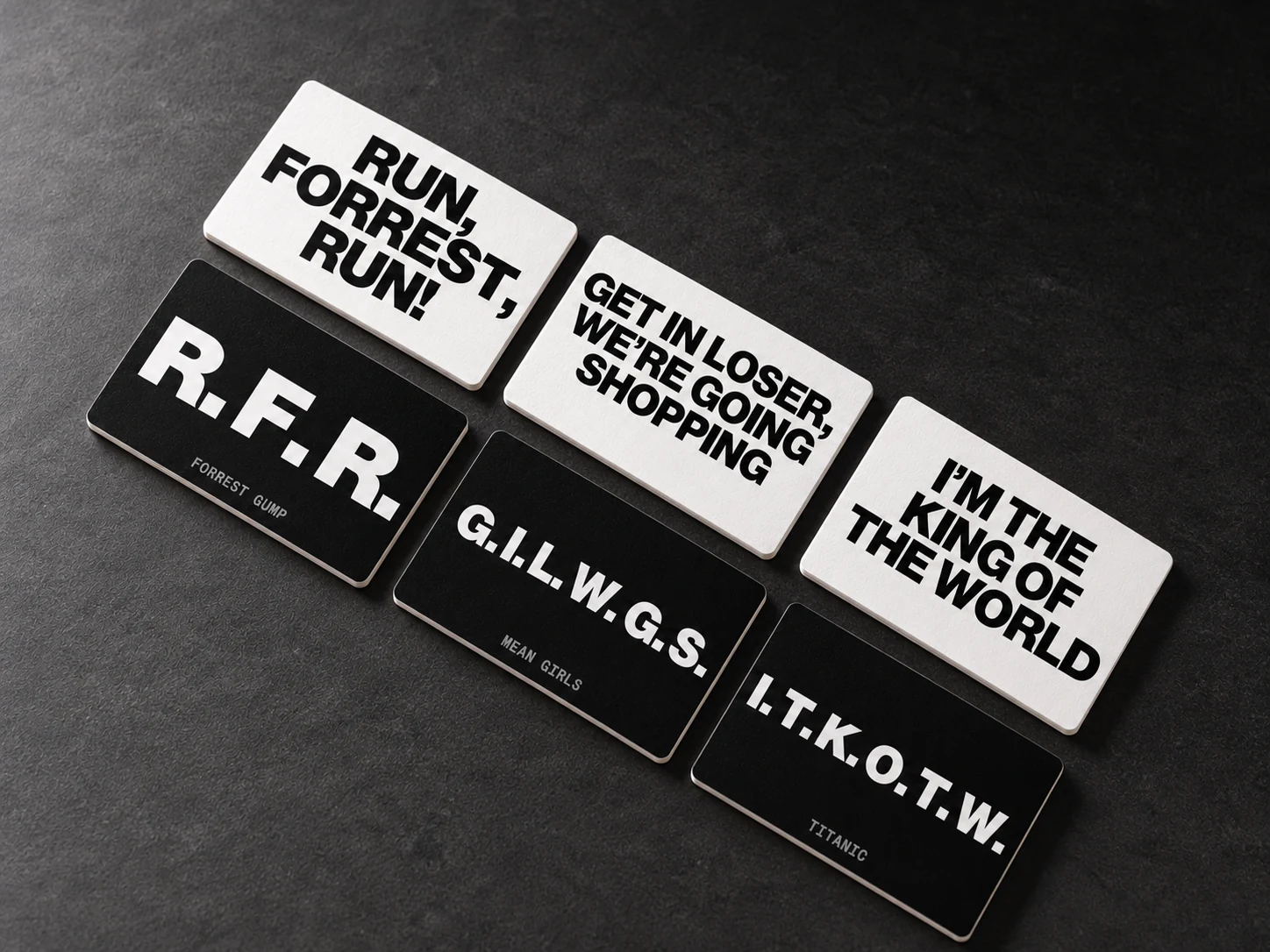 Three black initial cards paired with their white answer faces.